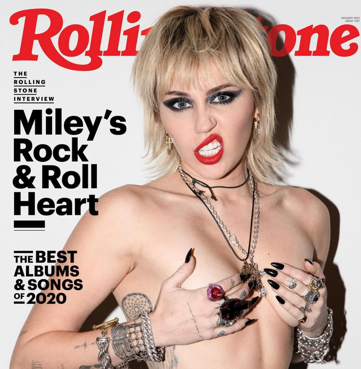 Rolling Stone magazine cover featuring a person with tattoos and jewelry, with 'Rolling Stone' logo at the top.